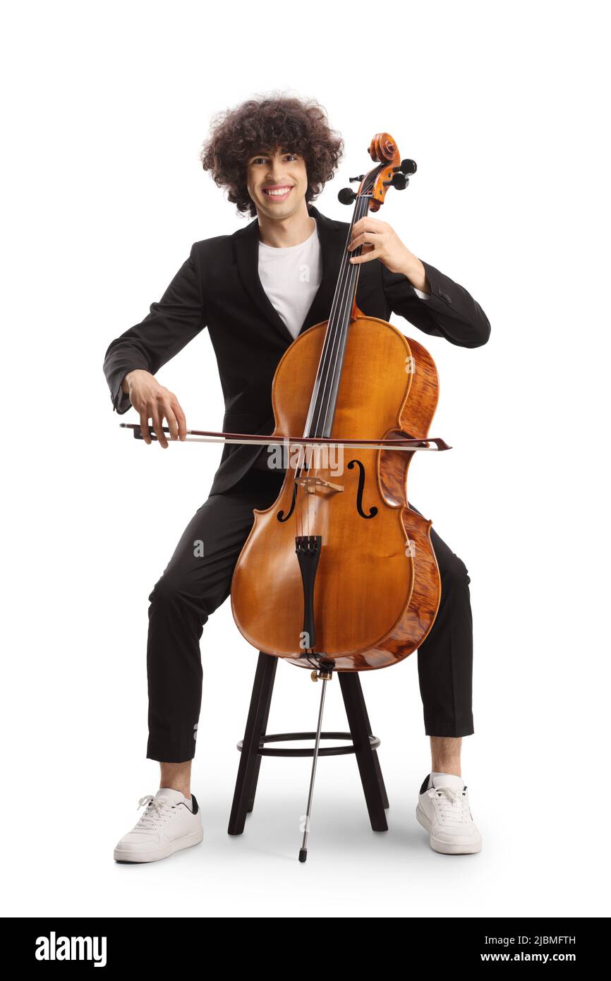 Young man sitting on a chair and playing a cello isolated on white