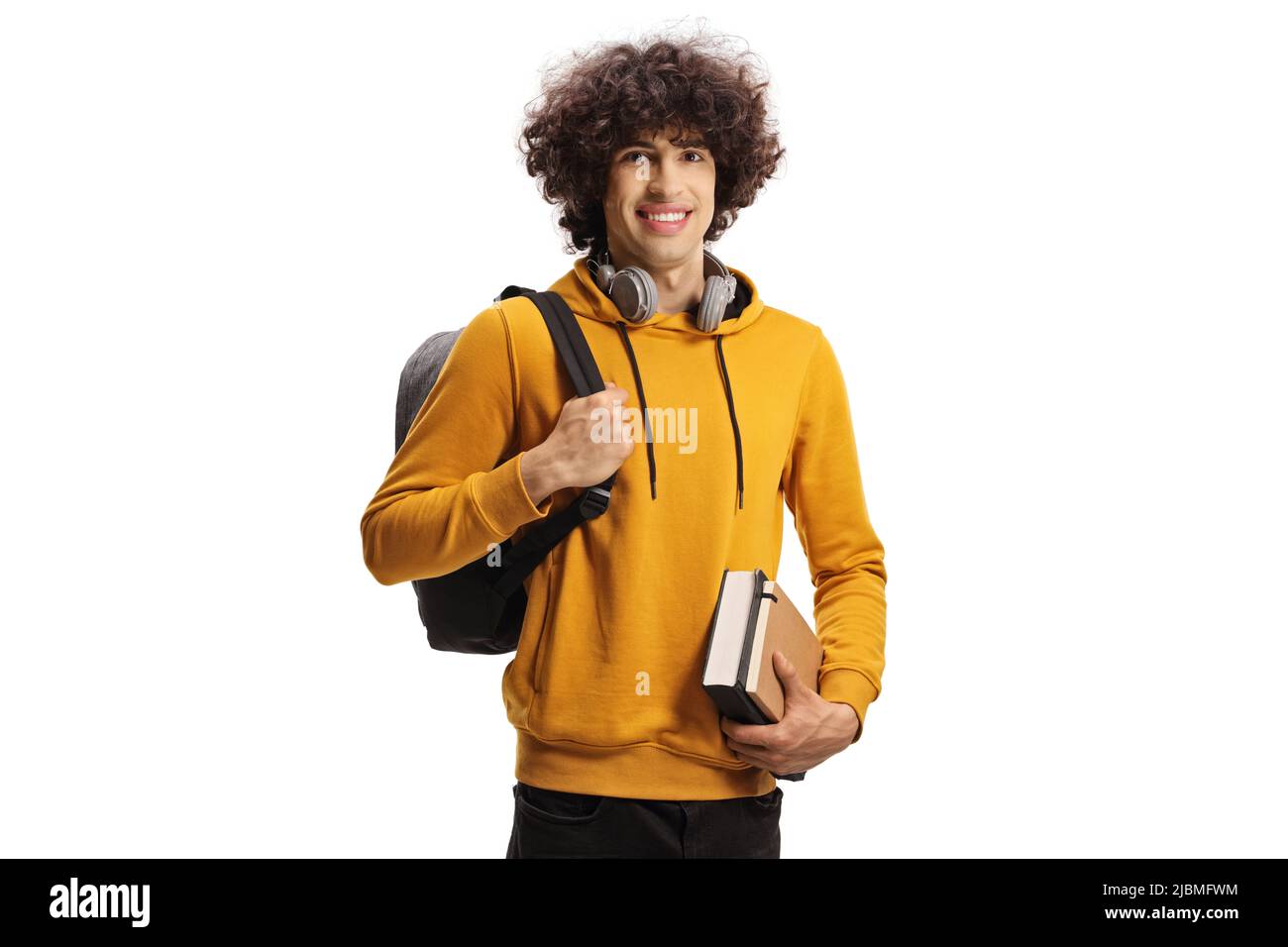 Smiling male student carrying a backpack and a book isolated on white ...