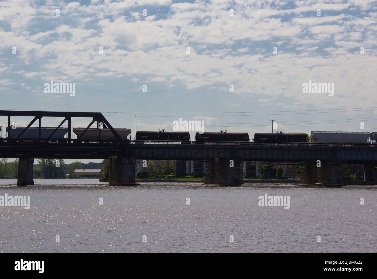Freight train on a rail bridge Stock Photo