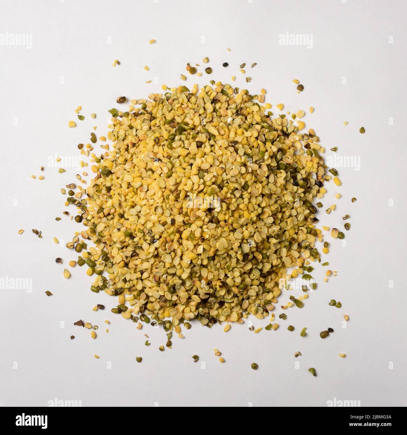 heap of split skin removed mung beans or green grams, also known as moong seeds, staple ingredient in southeast asian dishes, protein rich legumes Stock Photo