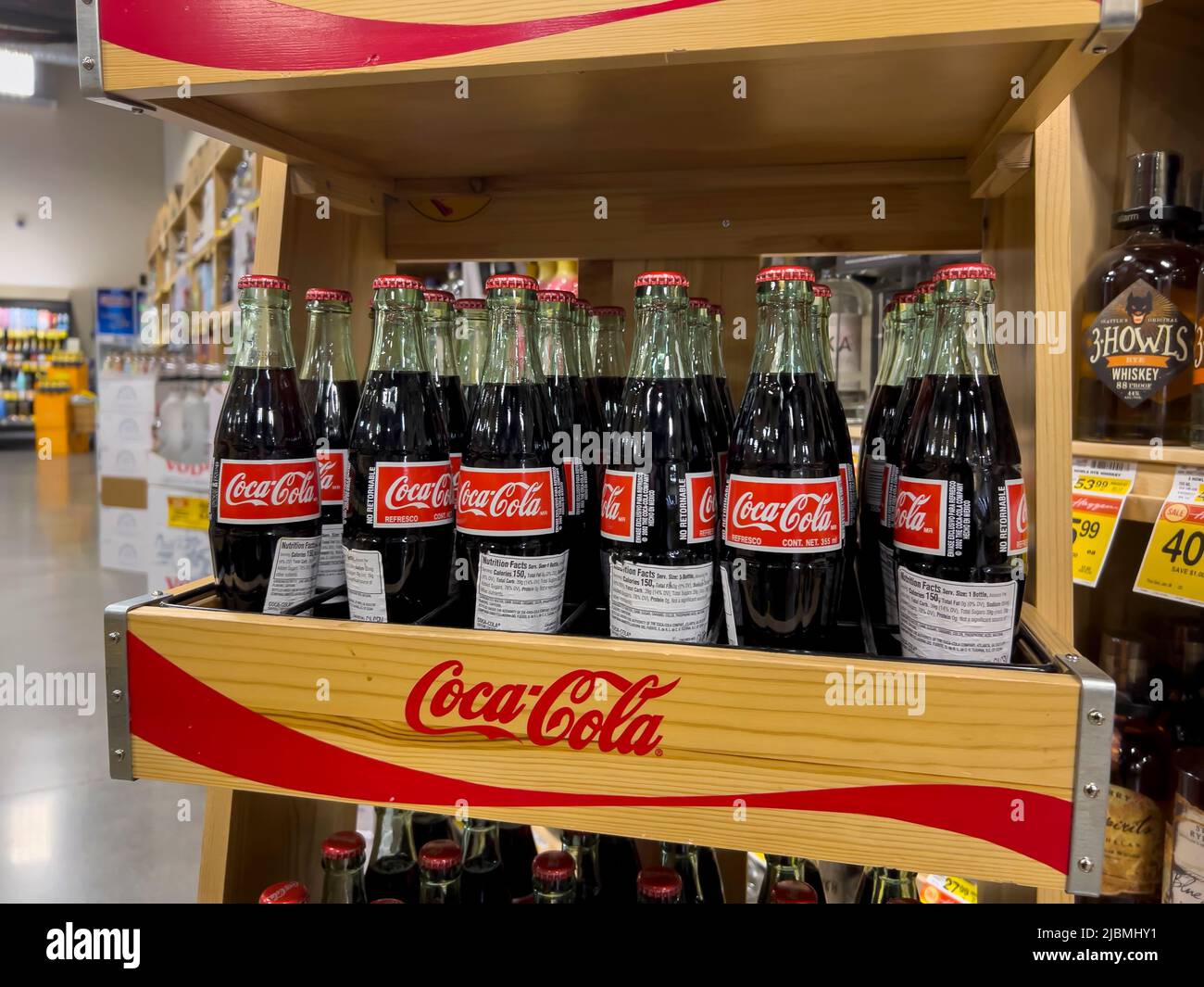 Woodinville, WA USA - circa May 2022: Angled view of Mexican Cokes for sale inside a Haggen grocery store. Stock Photo