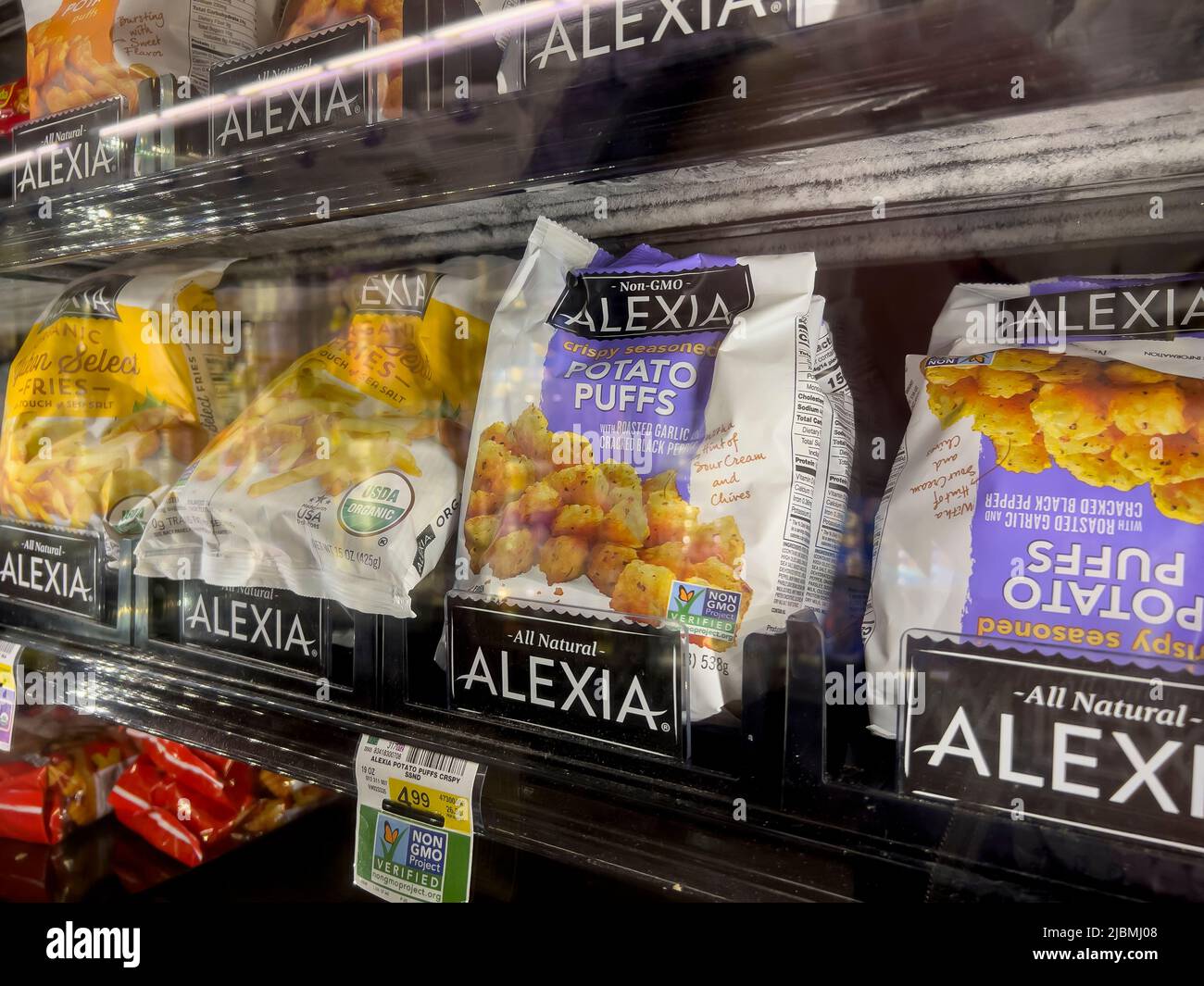 Woodinville, WA USA - circa May 2022: Angled view of Alexia brand potatoes for sale inside the freezer section of a Haggen grocery store. Stock Photo