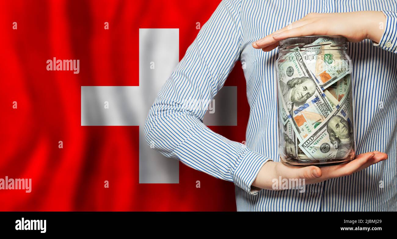 US dollars cash money in glass jar. Banking, business and currency exchange in Switzerland Stock Photo