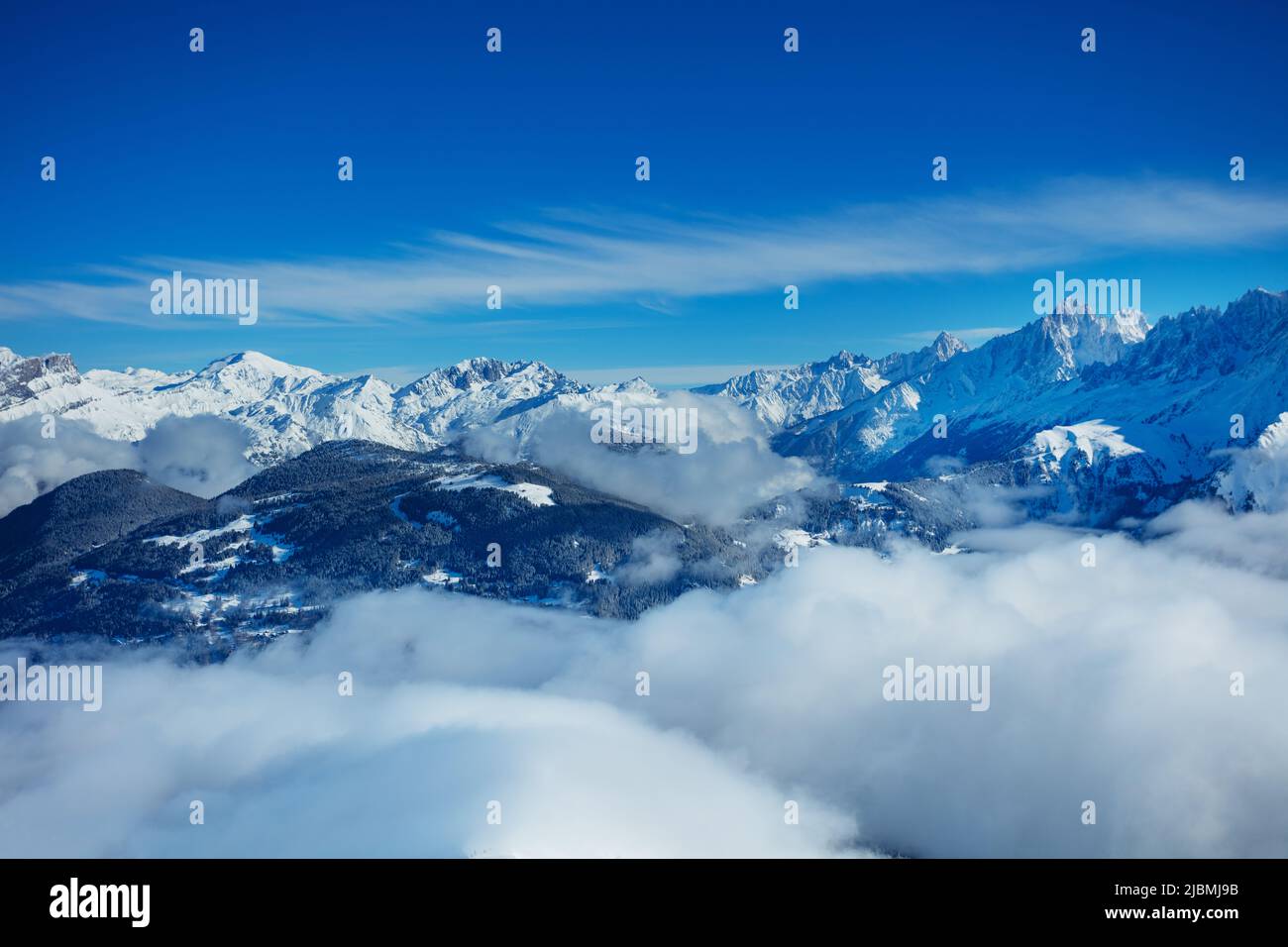Panorama above clouds of Alps mountains and Mont Blanc massif Stock Photo