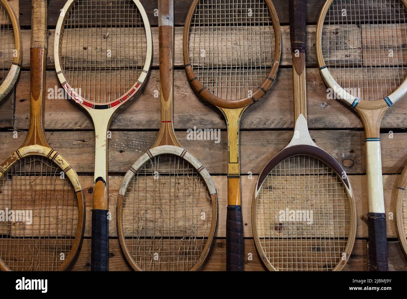 Old Fashioned Vintage and Broken Wooden Tennis Rackets or Racquets Stock Photo
