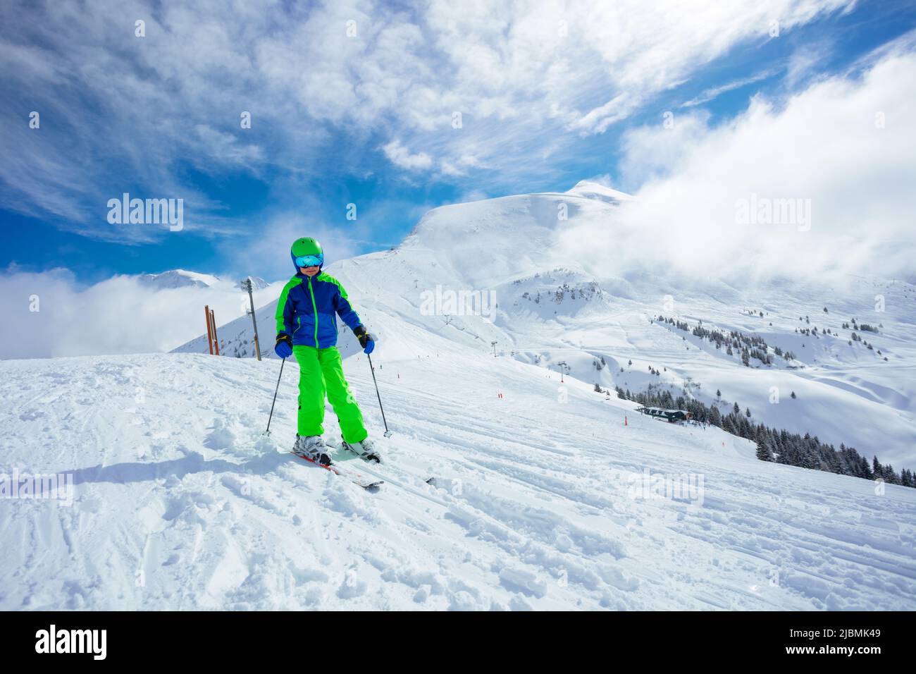 Preteen handsome boy ski downhill on mountain slope Stock Photo - Alamy