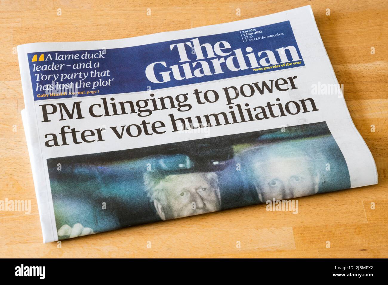 7 June 2022. The Guardian newspaper headline reads PM clinging to power after vote humiliation, after Boris Johnson survives a vote of no confidence. Stock Photo