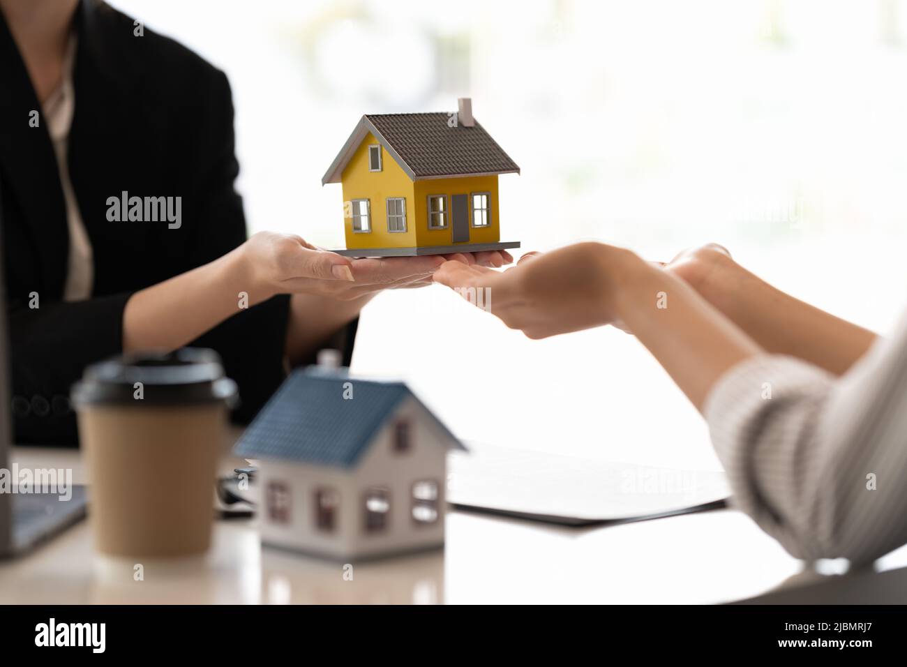 Home and real estate trading business. Real estate agent giving keys to