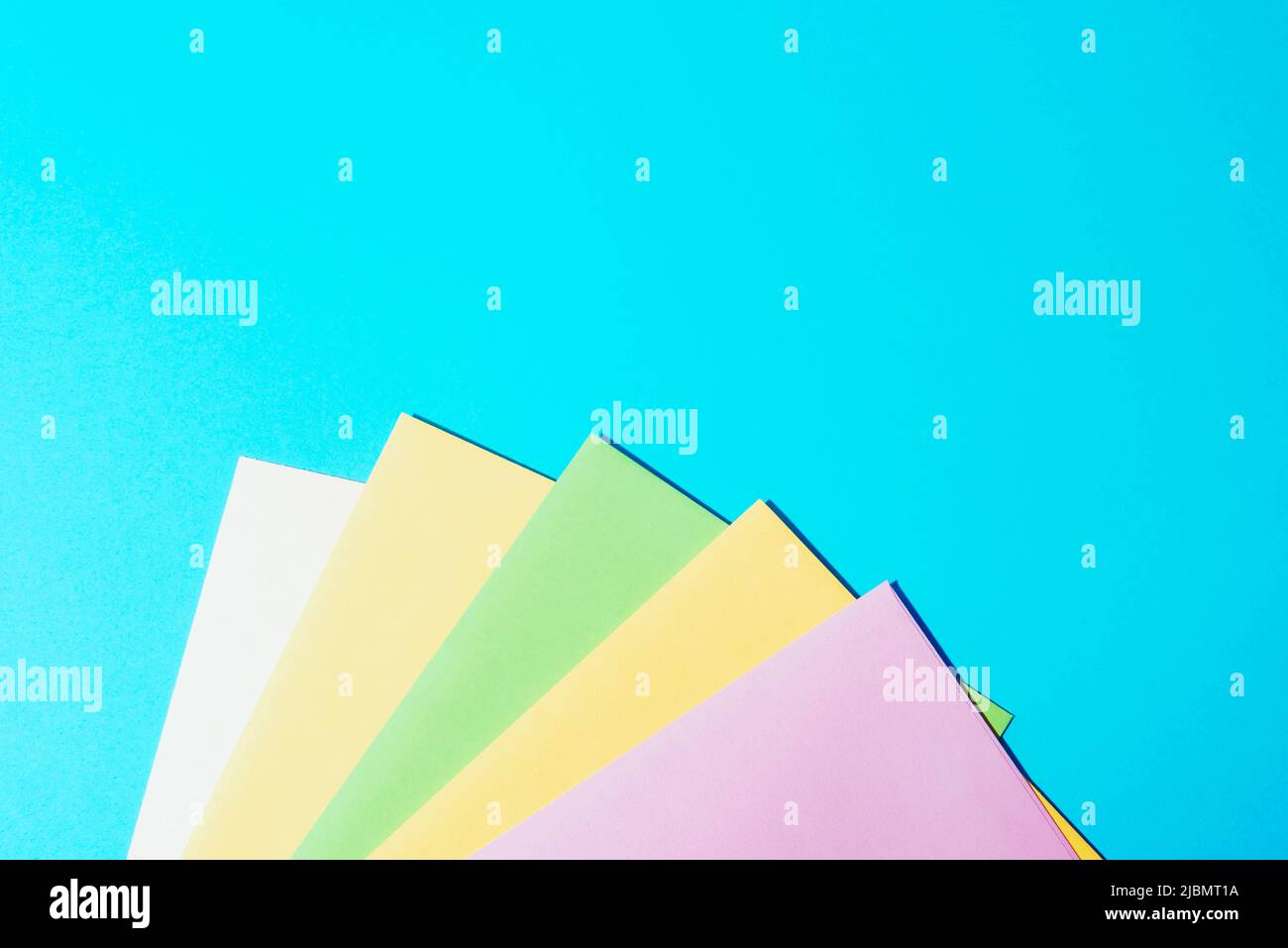 Colorful envelopes on light blue background. Top view, flat lay, copy space. Stock Photo