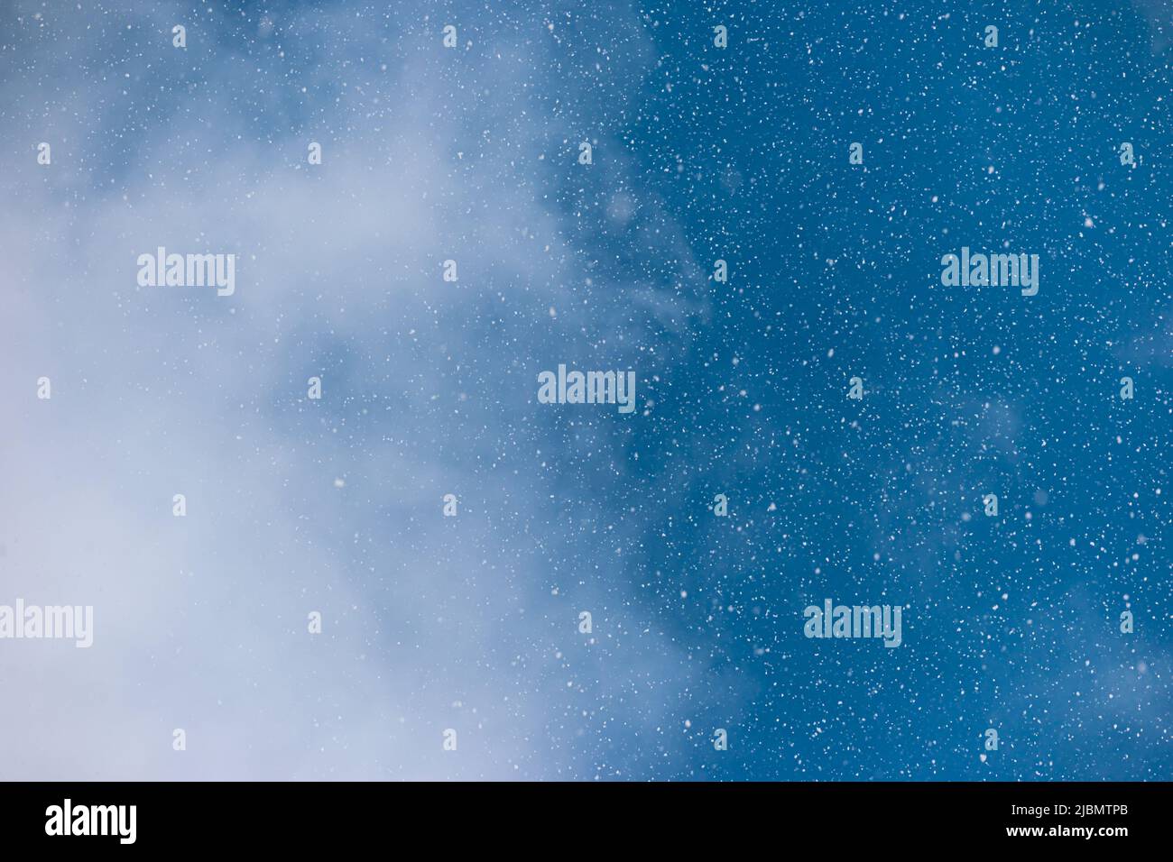 The sky during a snow storm blizzard with half cloud and half clear Stock Photo