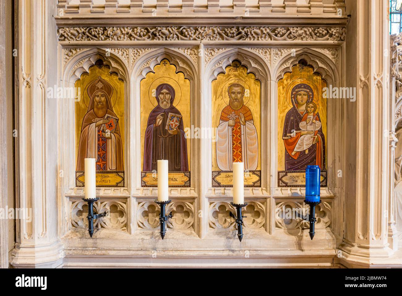 The painted icons to the left of the altar at Launde Abbey chapel including the Virgin Mary Stock Photo