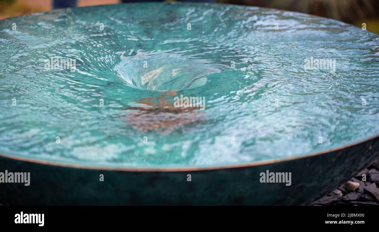 A whirlpool in a water feature Stock Photo