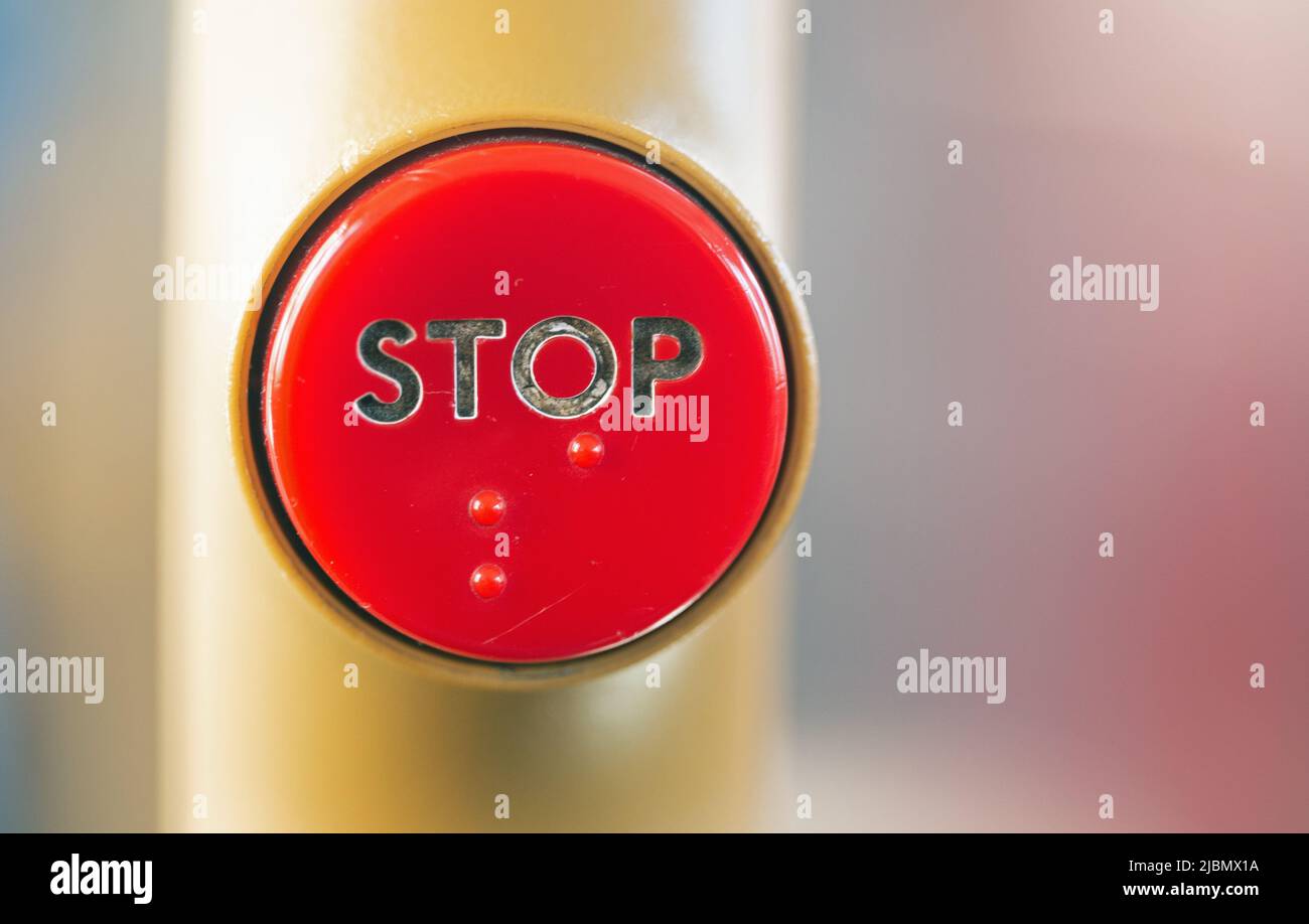 Close up photograph of a stop button on a bus Stock Photo