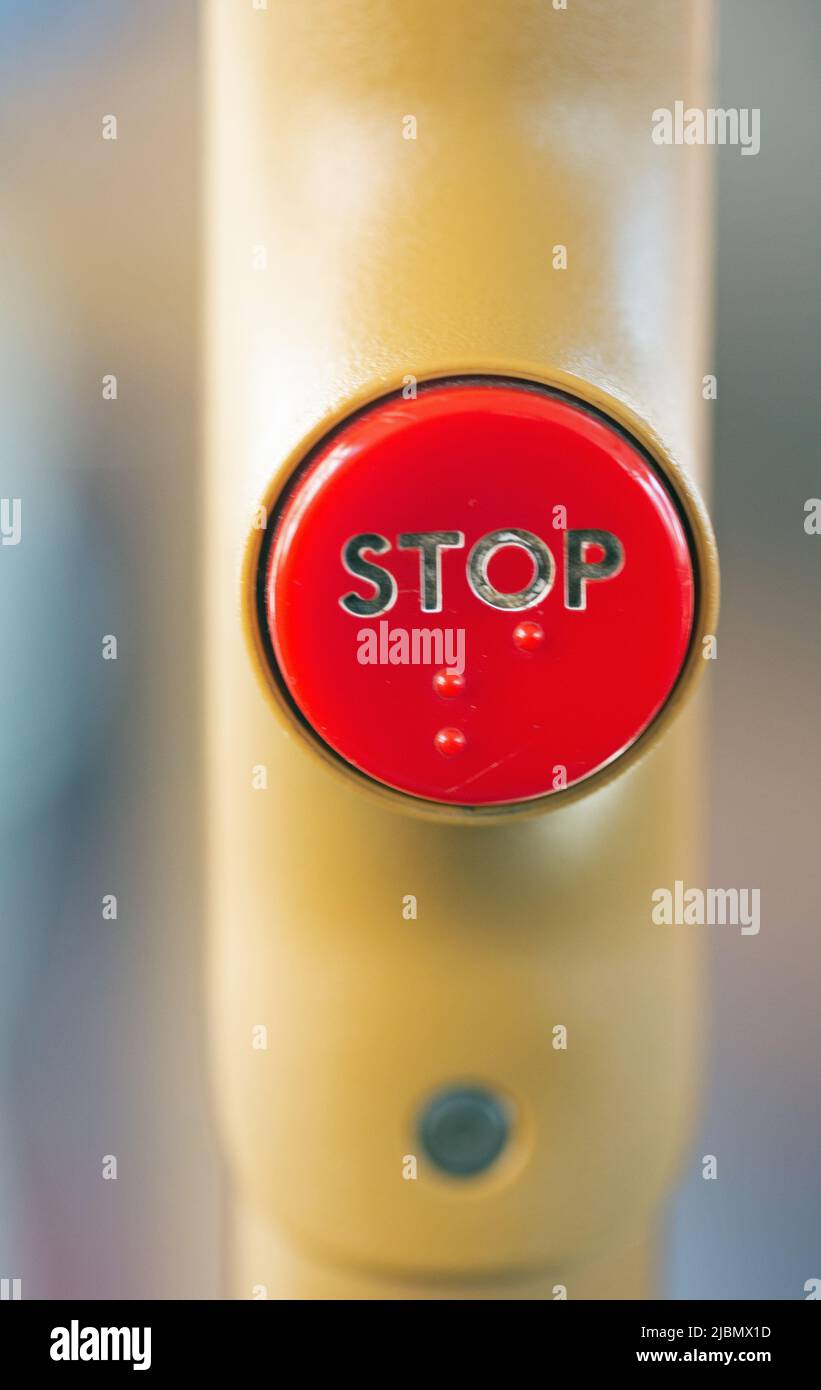 Close up photograph of a stop button on a bus Stock Photo - Alamy