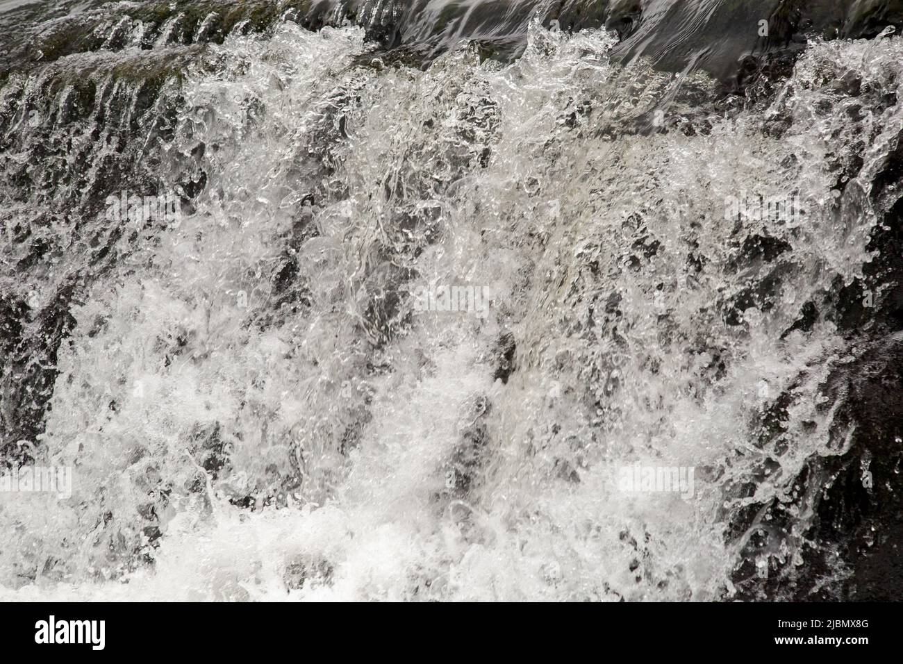 Batheaston Weir, River Avon, Bathampton, Bath, England, May 26th 2022, Water flowing over the weir Stock Photo