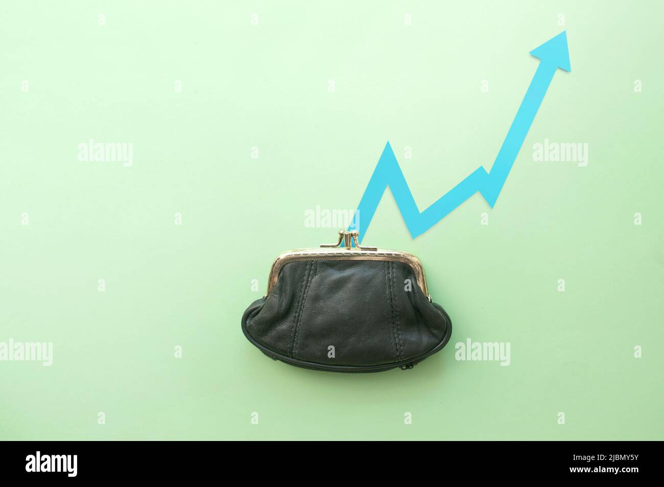 Purse with arrow on the rise Stock Photo