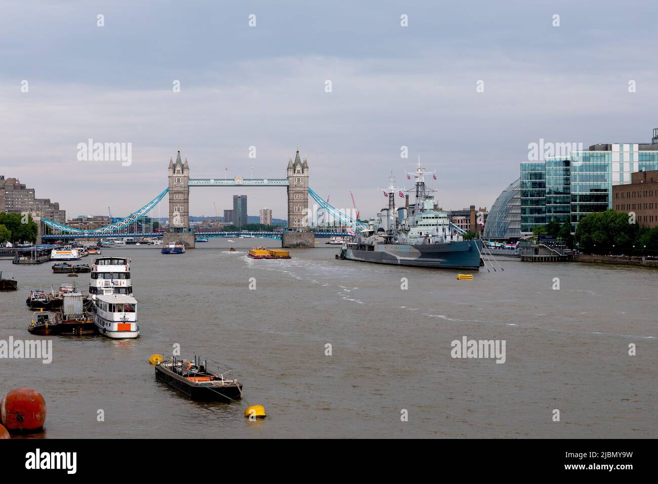 View along the river thames with HMS Belfast and tower bridge Stock Photo