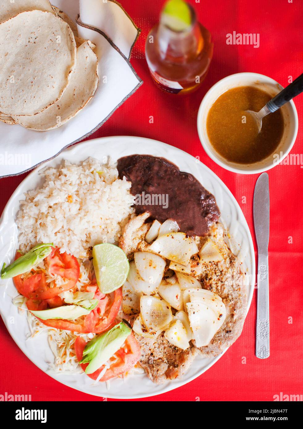Poc Choc, a signature pork dish with onions, is the best-selling dish at Loncheria El Poc-Choc in downtown Isla Mujeres, Quintana Roo, Mexico. Stock Photo