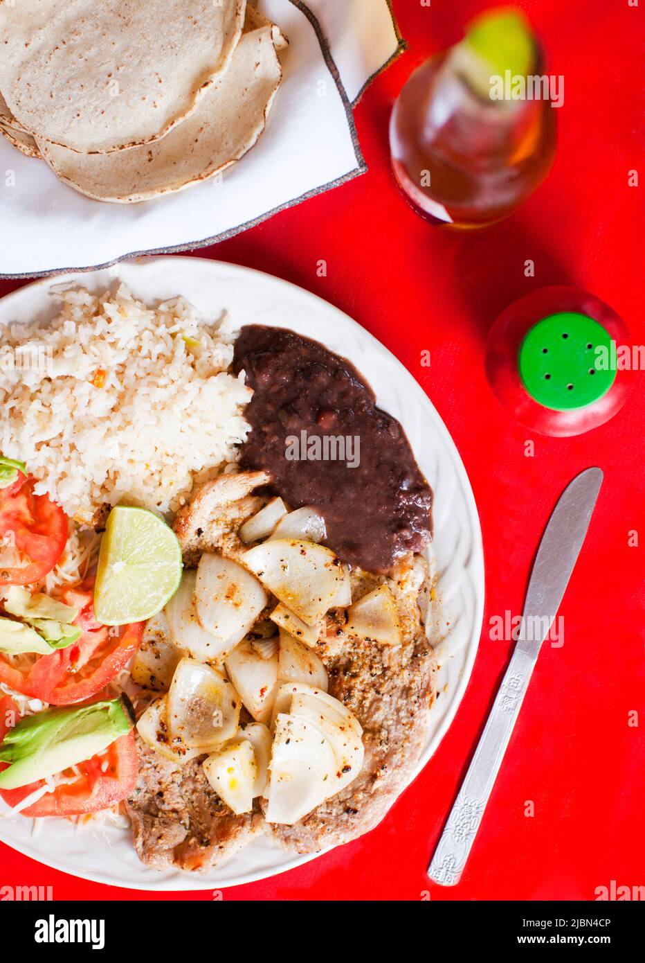 Poc Choc, a signature pork dish with onions, is the best-selling dish at Loncheria El Poc-Choc in downtown Isla Mujeres, Quintana Roo, Mexico. Stock Photo