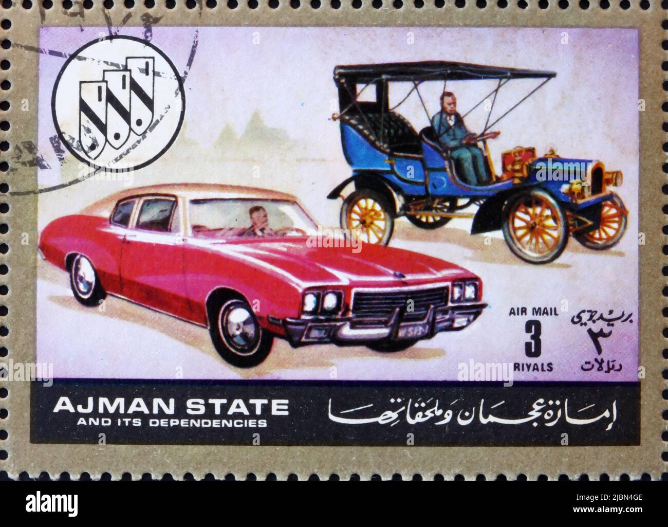 AJMAN - CIRCA 1972: a stamp printed in the Ajman shows Chevrolet, Cars Then and Now, circa 1972 Stock Photo