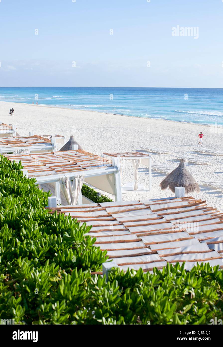 Man jogging on Cancun’s Hotel Zone Beach in front of Live Aqua Resort & Spa. Cancun’s Hotel Zone. Cancun. Mexico. Stock Photo