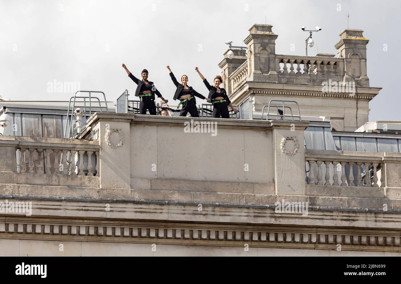 EDITORIAL USE ONLY The cast of SIX the musical perform from the rooftop
