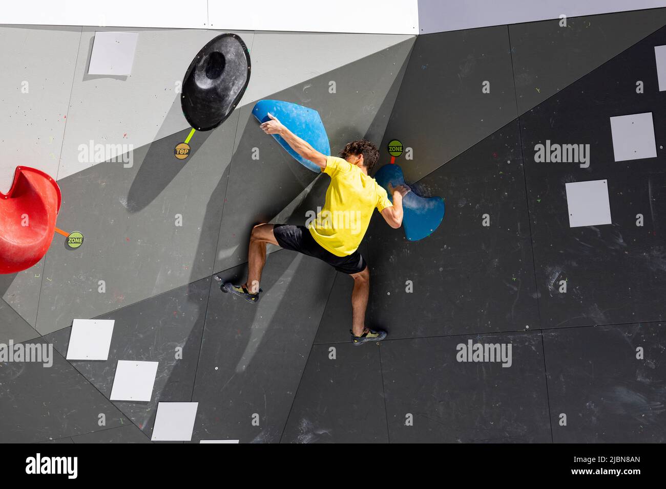 Climber. Young male and female competitors in the Madrid Block Climbing
