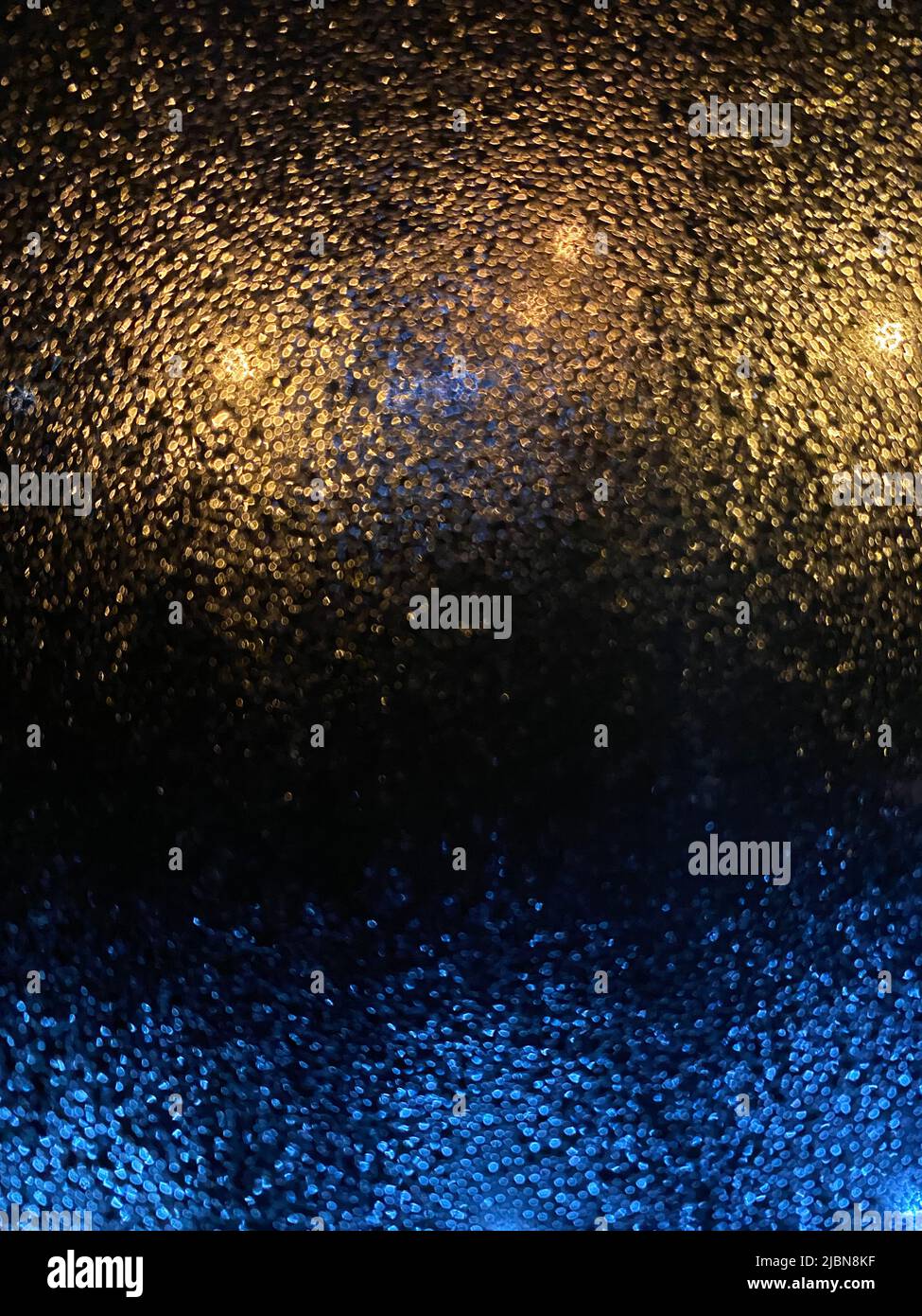 Photo of small rain splash drops on the windowpane, abstract images for backgrounds. Stock Photo