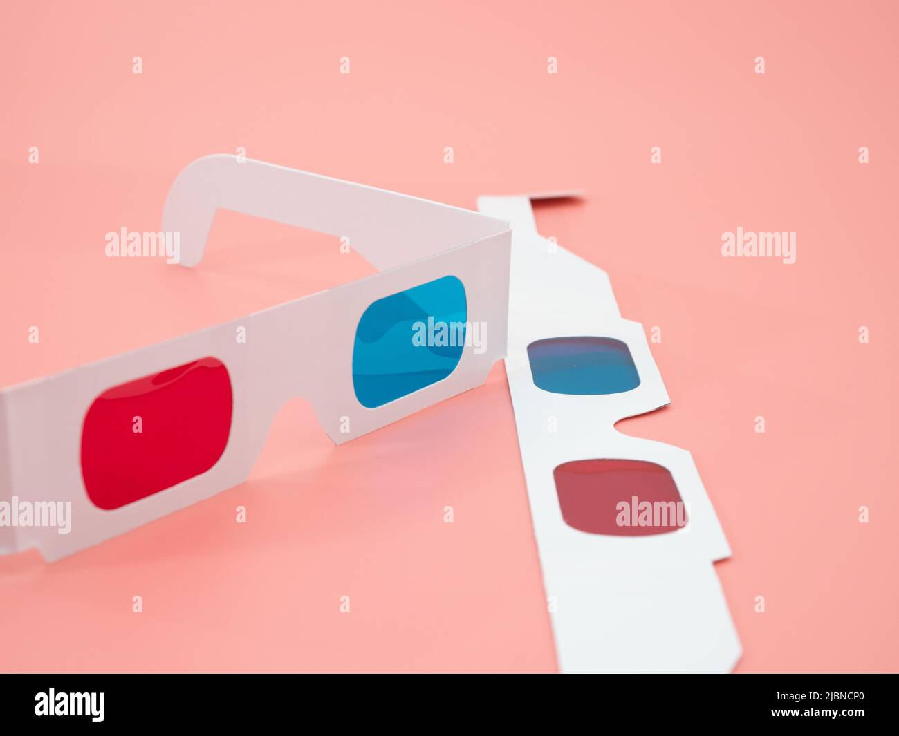 Red And Blue Paper Glasses For Viewing 3d Movies And Images Isolated On A Pink Background Stock 2349