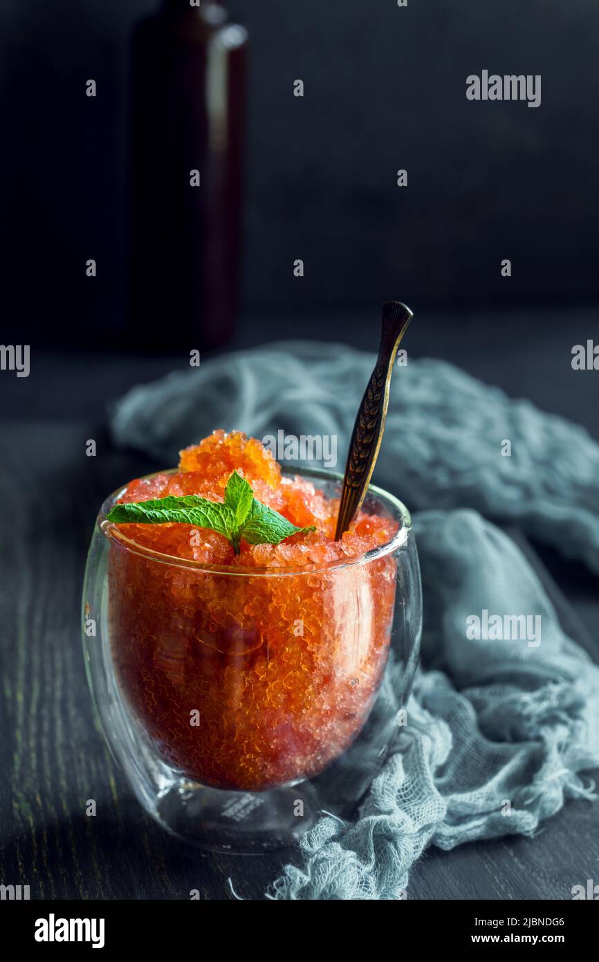 Watermelon granita in thermo glass with mint on dark background Stock Photo