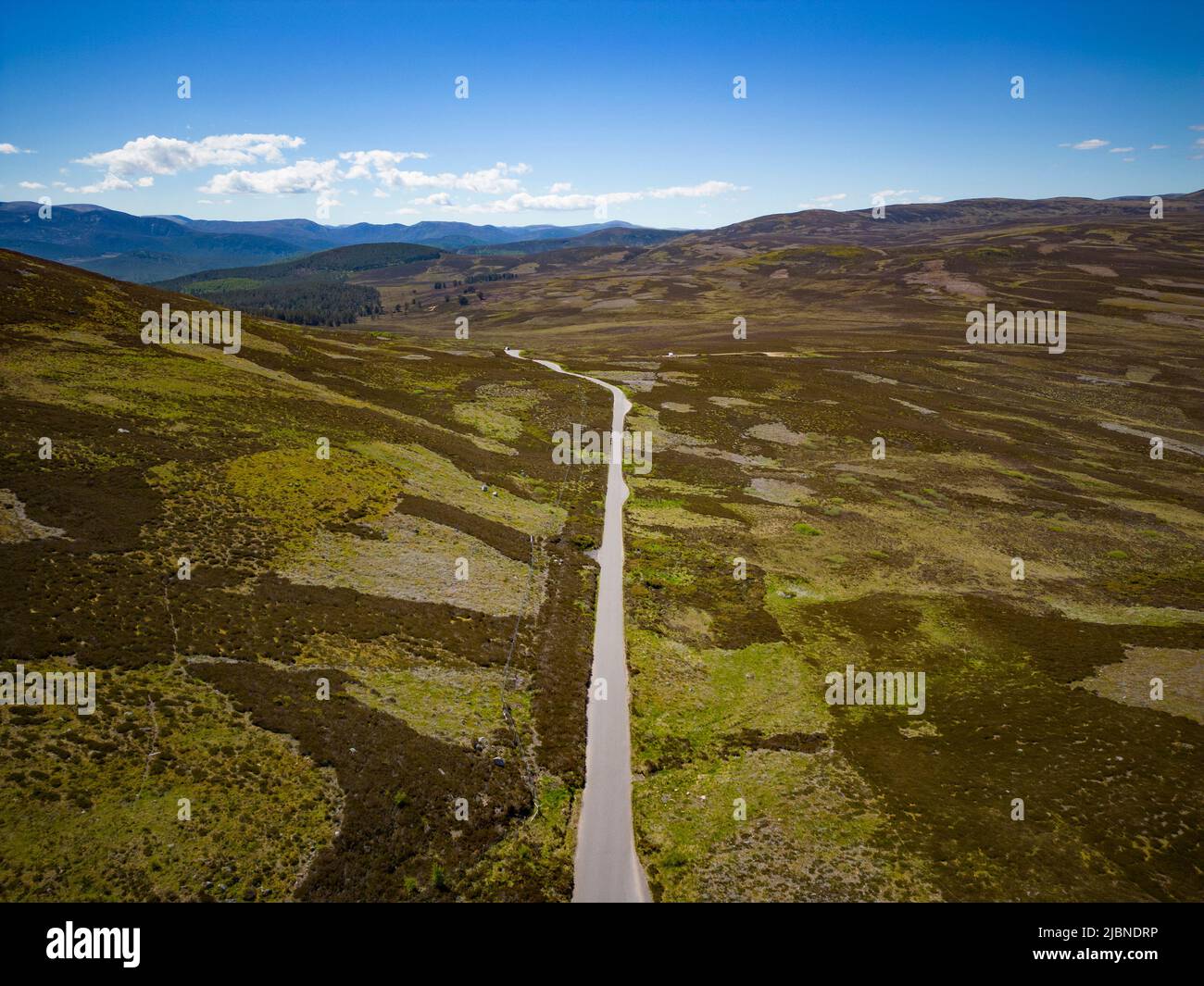 Aerial view from drone of empty B976 road crossing moorland , Old Military Road, north of Balmoral in Aberdeenshire Scotland, UK Stock Photo