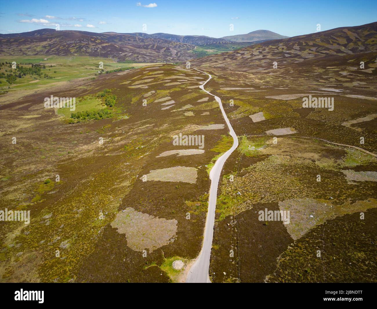 Aerial view from drone of empty B976 road crossing moorland , Old Military Road, north of Balmoral in Aberdeenshire Scotland, UK Stock Photo