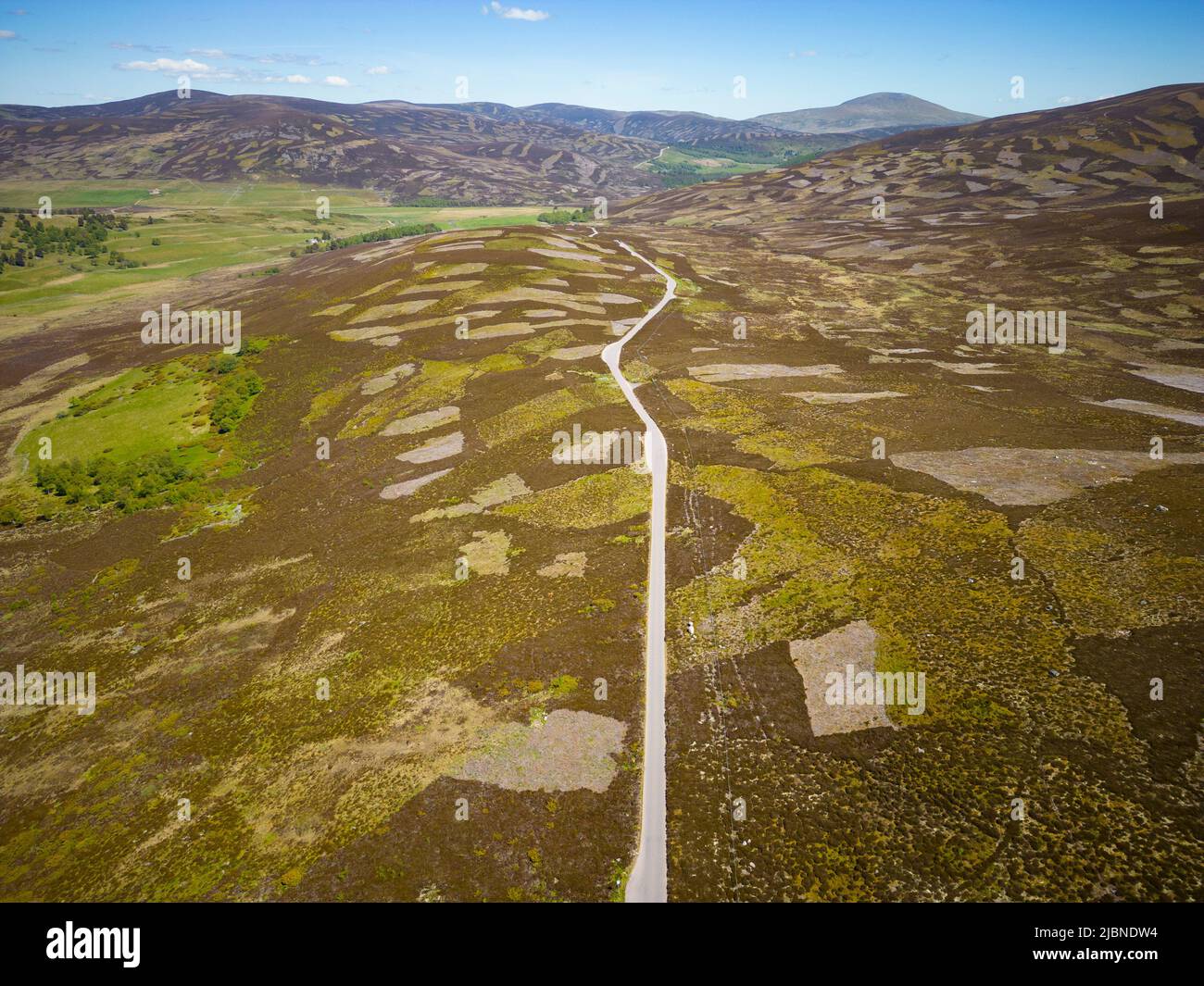 Aerial view from drone of empty B976 road crossing moorland , Old Military Road, north of Balmoral in Aberdeenshire Scotland, UK Stock Photo