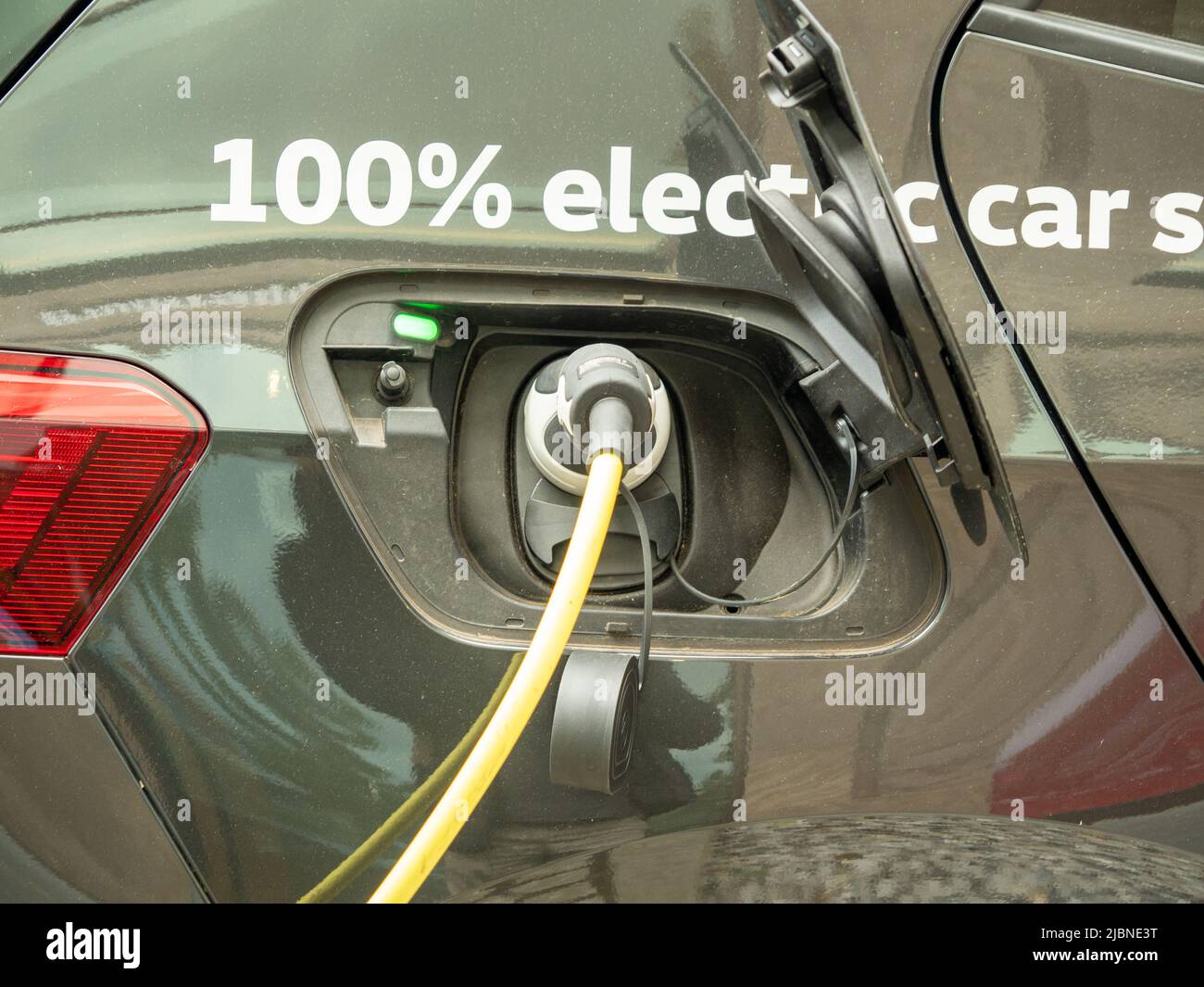 The electric car is charging. Car charging Stock Photo Alamy