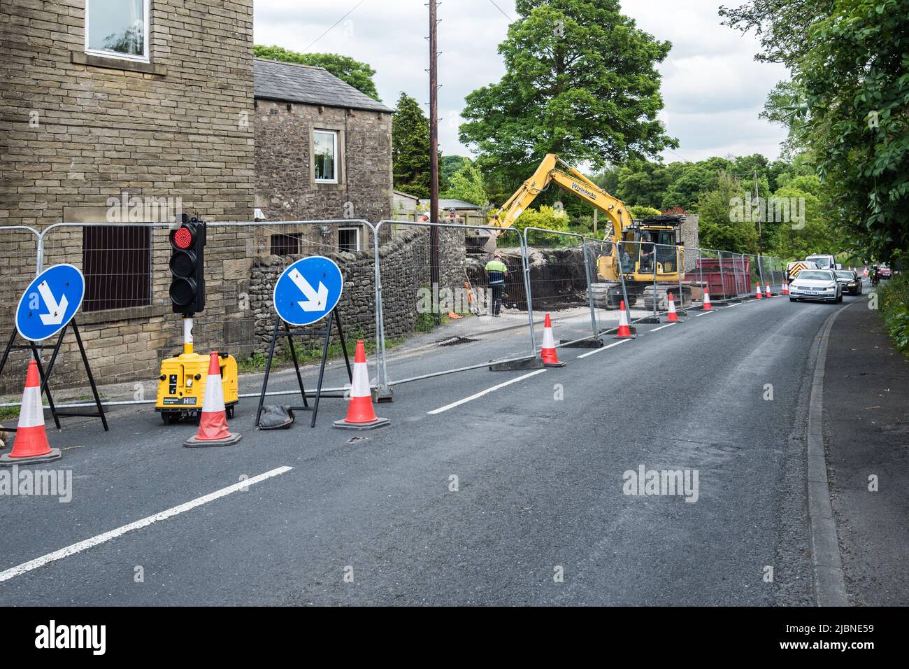 Traffic lights on the A65 at Kayley Hill Long Preston , where one lane is closed for up to 6 weeks whilst a wall is taken down and rebuilt Stock Photo