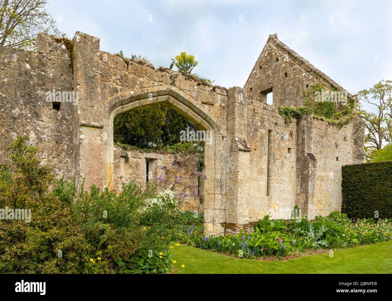 The ruins of the 15th-century tithe barn in the grounds of Castle, Sudeley, Gloucestershire, Cotswolds, England, Great Britain, UK. Stock Photo