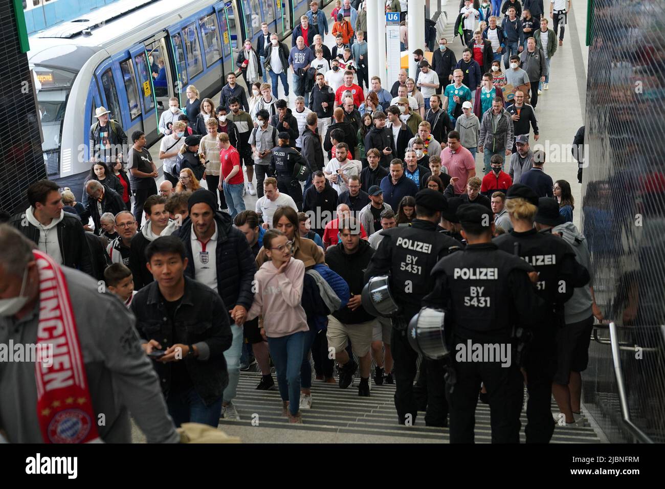 Football fans arrive at Frottmaning station in Munich, Germany ahead of the Germany v England UEFA Nations League game at Allianz Arena. Picture date: Tuesday June 7, 2022. Stock Photo