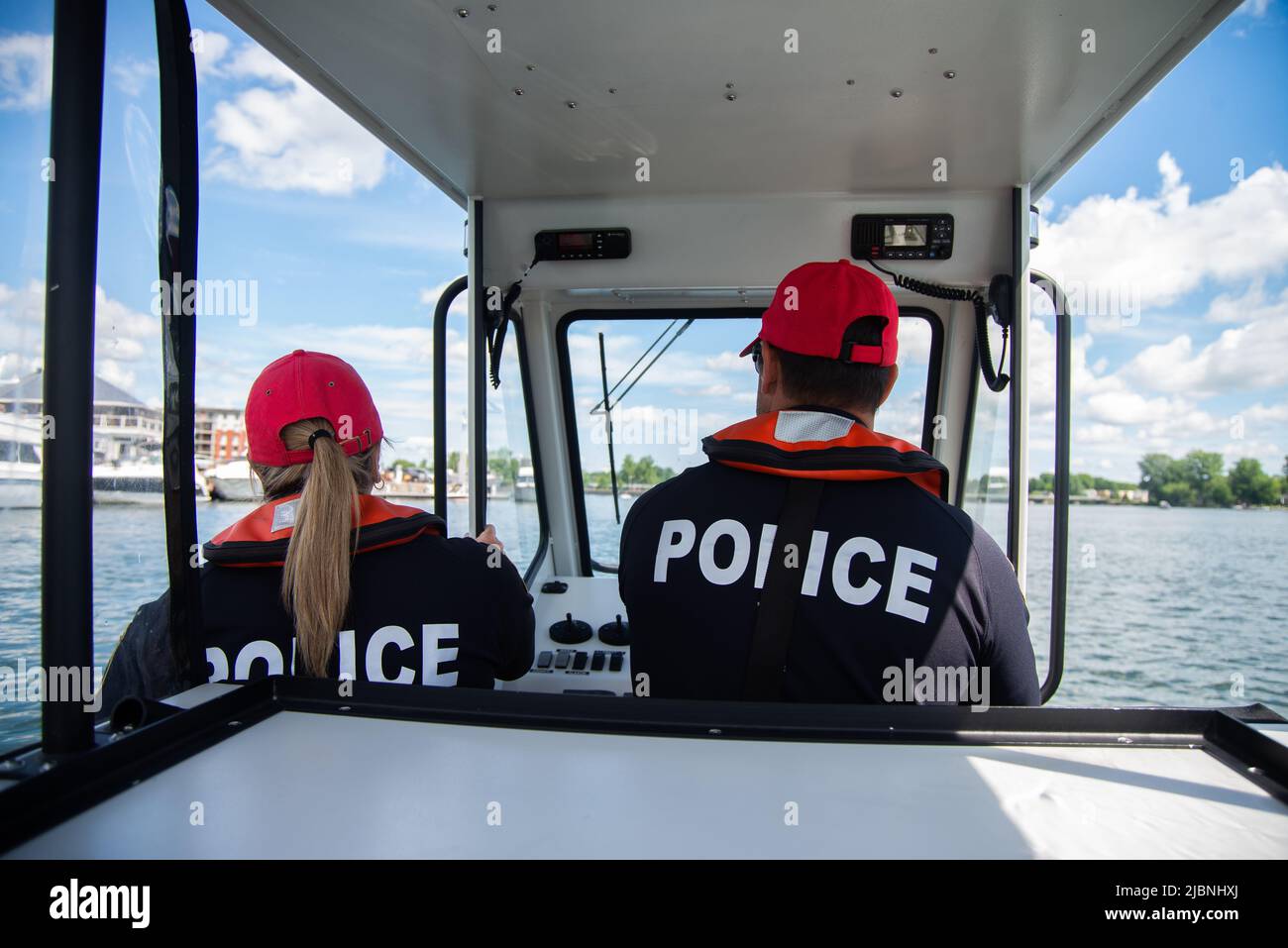 Police officers on a police boat, on the water. Prevention. Stock Photo