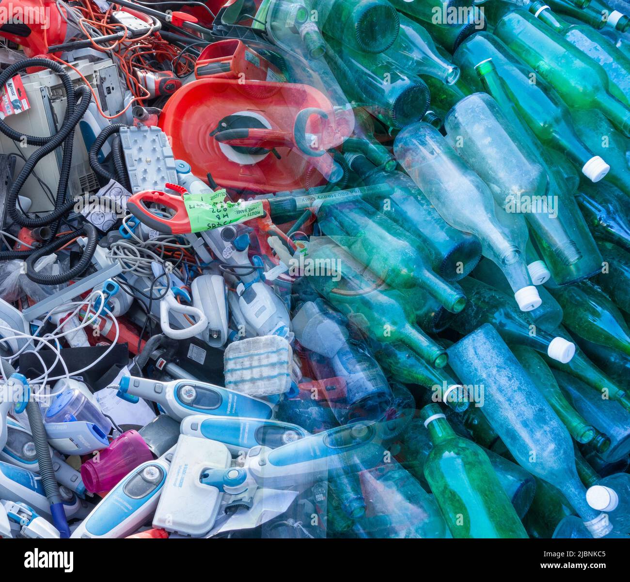 Waste plastic, vacuum cleaners... and glass recycling composite image. Throw away society, consumerism, global warming pollution...concept Stock Photo
