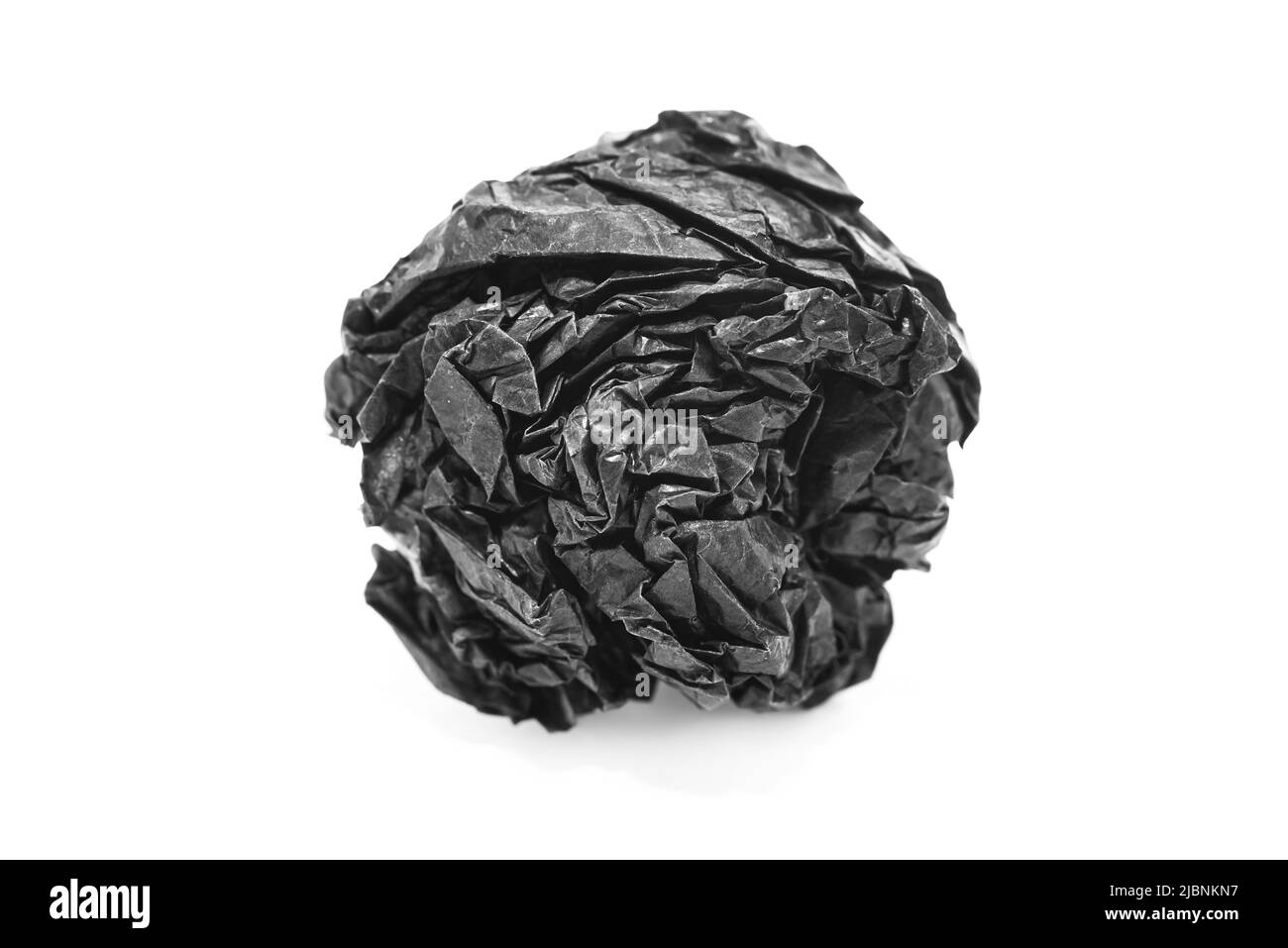 Paper. Crumpled ball of black paper on a white background Stock Photo