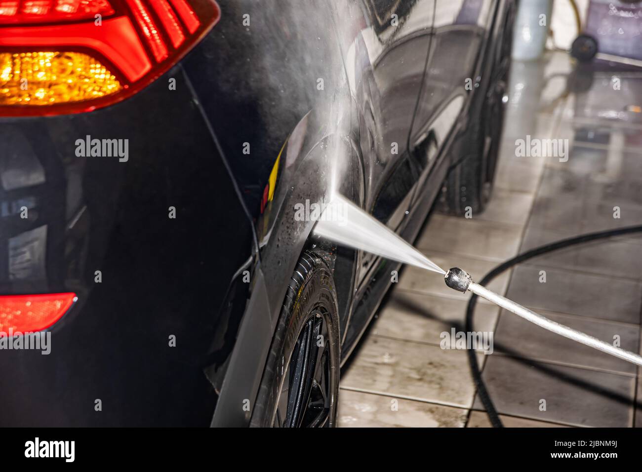 Professional manual car wash. Car wash with high pressure water Stock