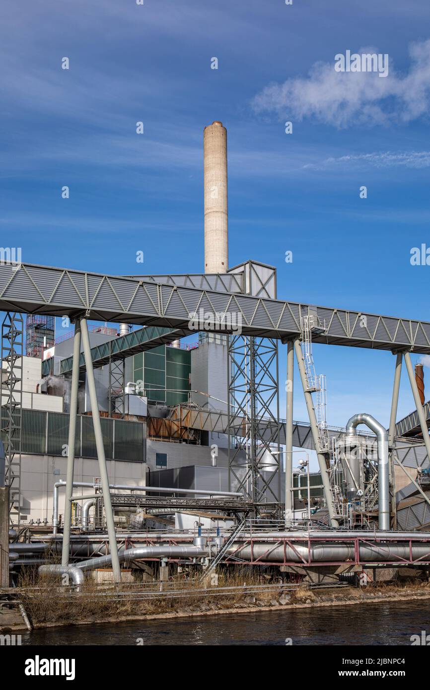 Chimney, conveyors and pipelines at Stora Enso paper mill industrial plant in Varkaus, Finland Stock Photo