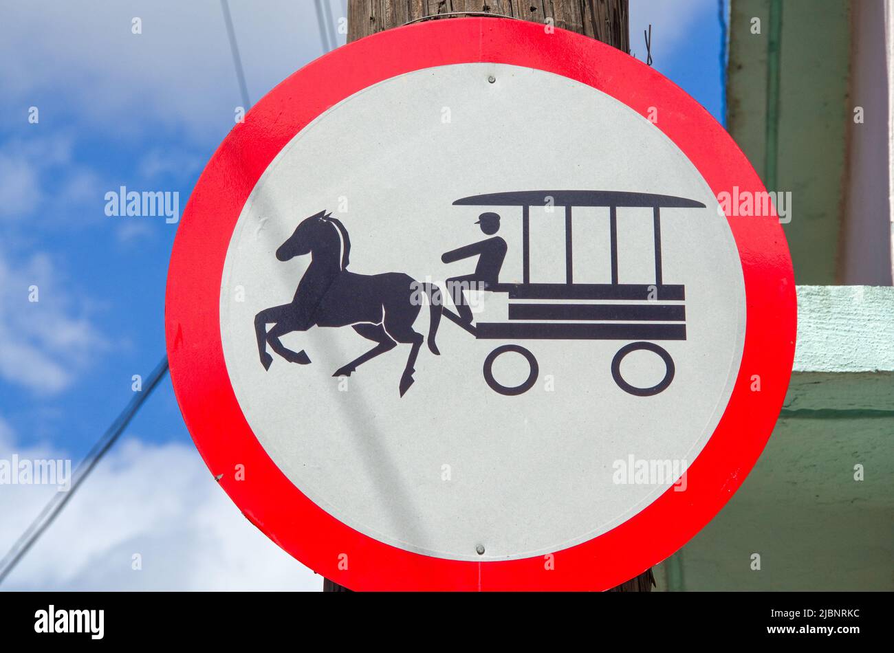 Traffic sign prohibiting the circulation of horse carts in the city street. Stock Photo