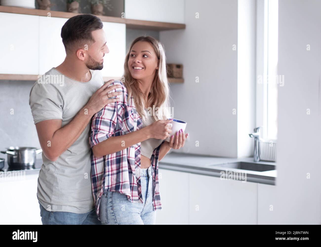 young couple in the kitchen in good morning Stock Photo - Alamy