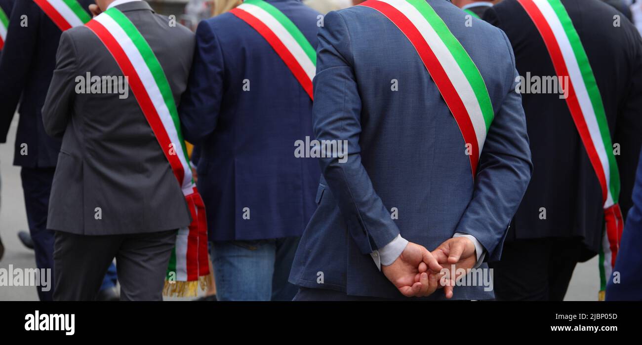 Many italian mayors with tricolor green white and red band during meeting Stock Photo
