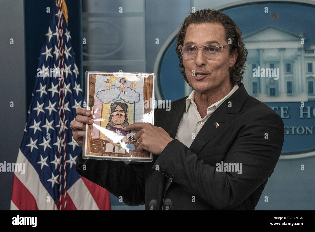 Washington, United States. 07th June, 2022. Matthew McConaughey, a native of Uvalde, Texas, holds up artwork by one of the victims of the mass shooting at Robb Elementary School shooting at a press conference on gun violence in the James S. Brady Press Briefing Room at the White House in Washington, DC on Tuesday, June 7, 2022. Photo by Ken Cedeno/UPI . Credit: UPI/Alamy Live News Stock Photo