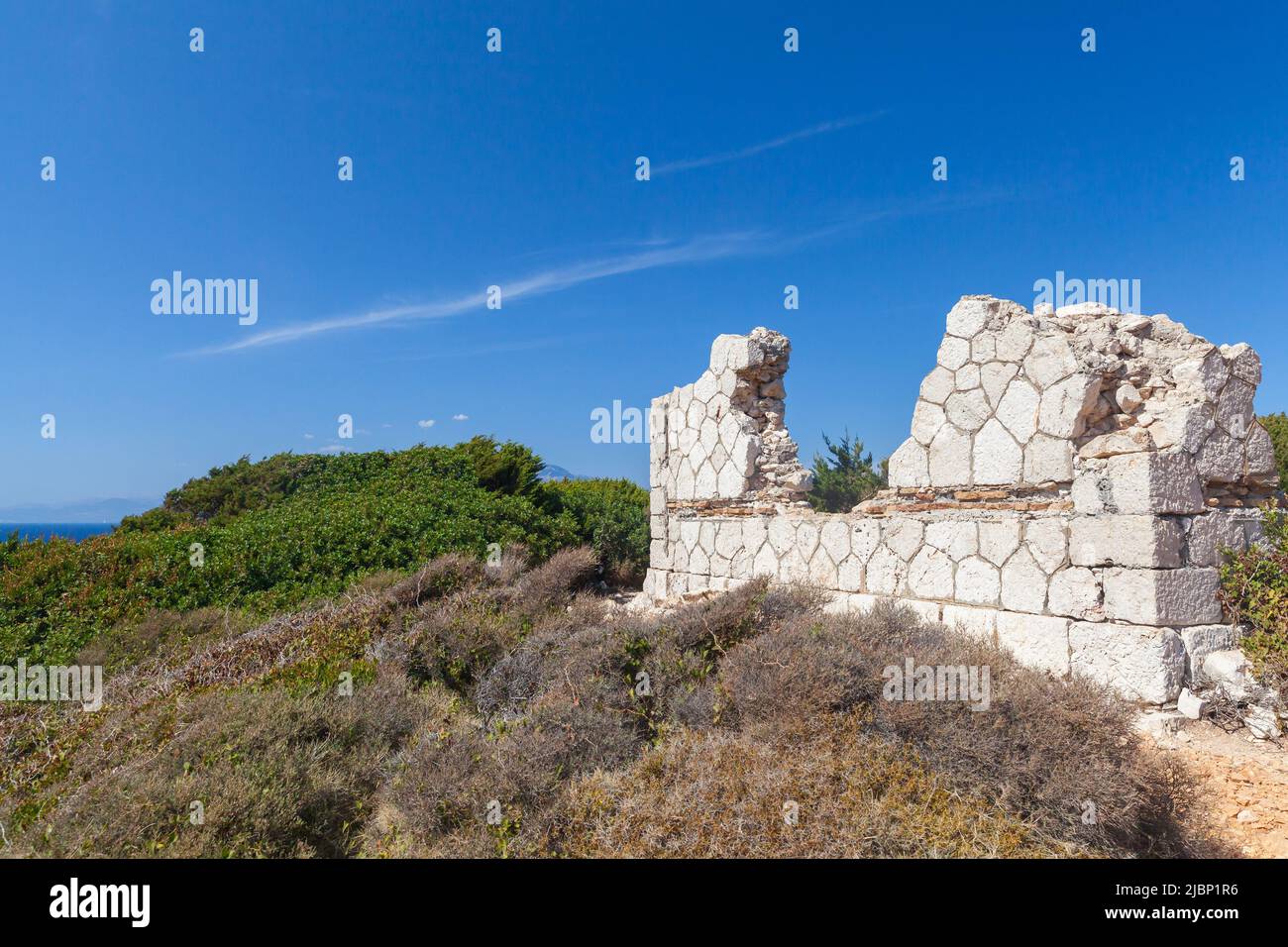 Greek summer landscape with ruins of an old stone house on a sunny day. Zakynthos, Greece Stock Photo