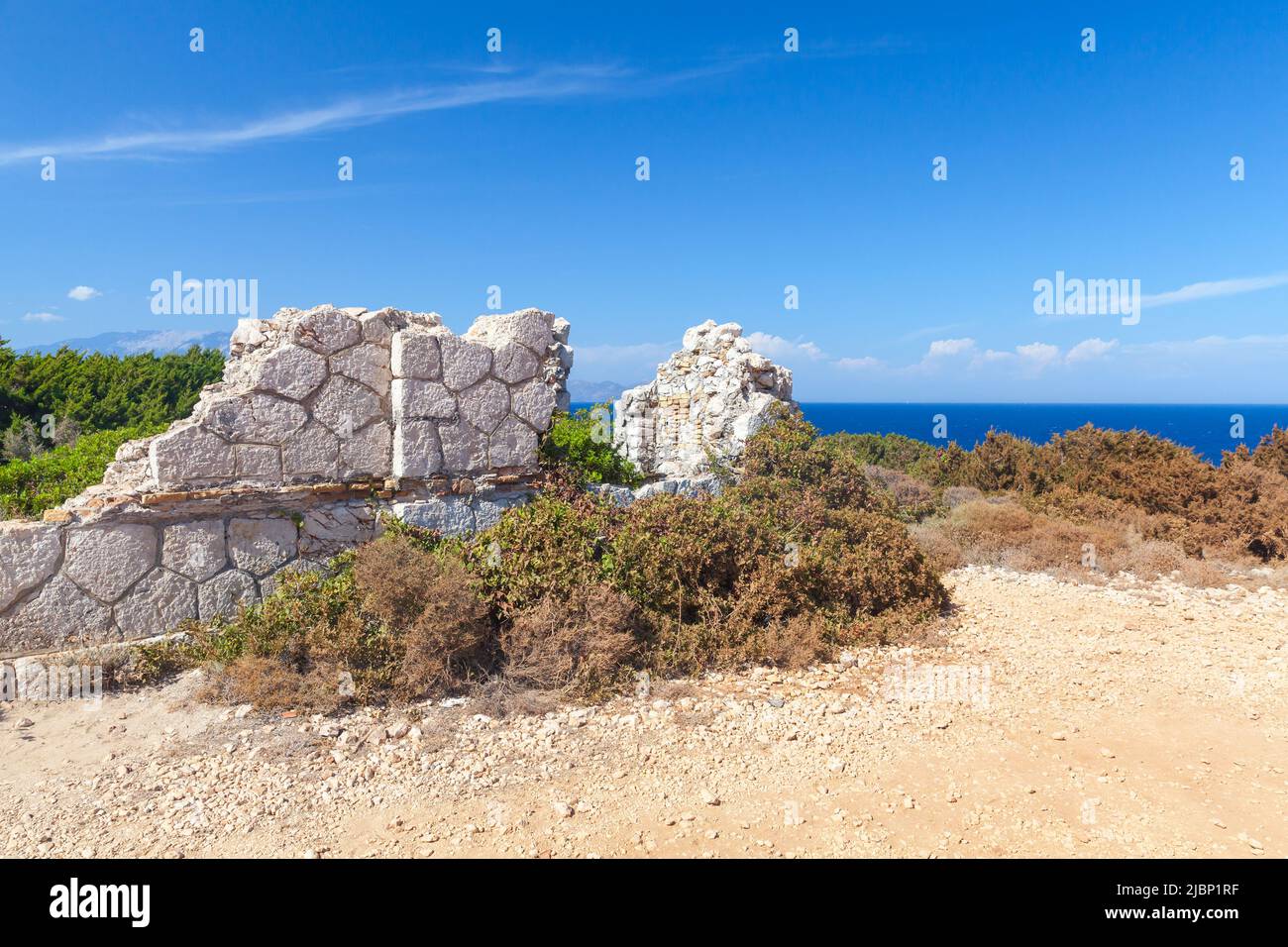 Ruins of an old stone house on a sunny day. Landscape of Zakynthos, Greek island in the Ionian Sea Stock Photo