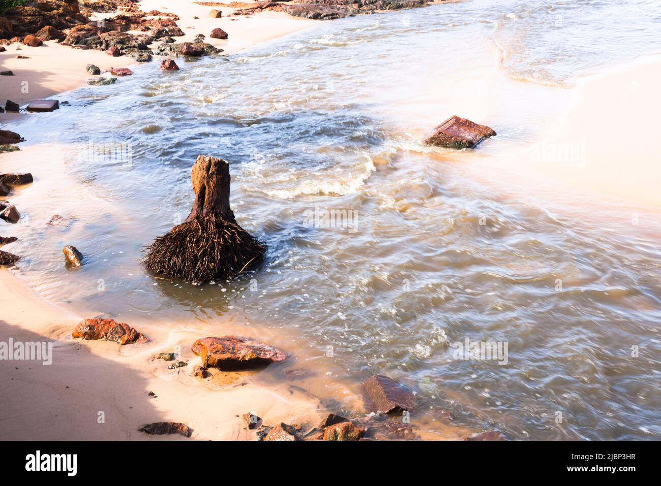 View of the river that flows into Boca do Rio beach in Salvador in the ...