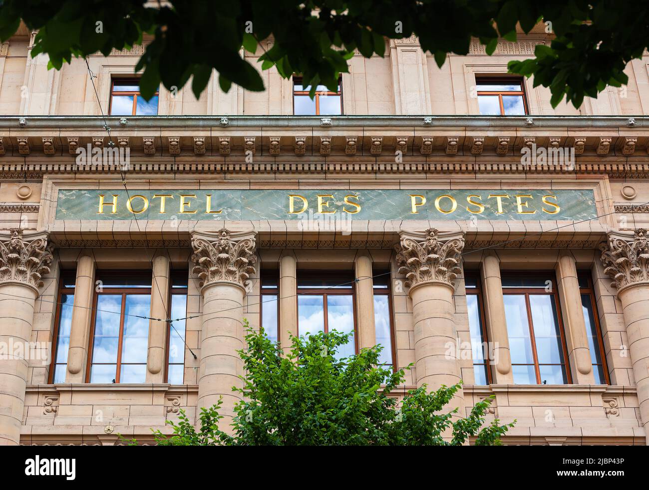 Geneva, Switzerland - June 3, 2022: The Hotel des Postes is a post office building in neoclassical architecture style, located at rue du Mont-Blanc, i Stock Photo